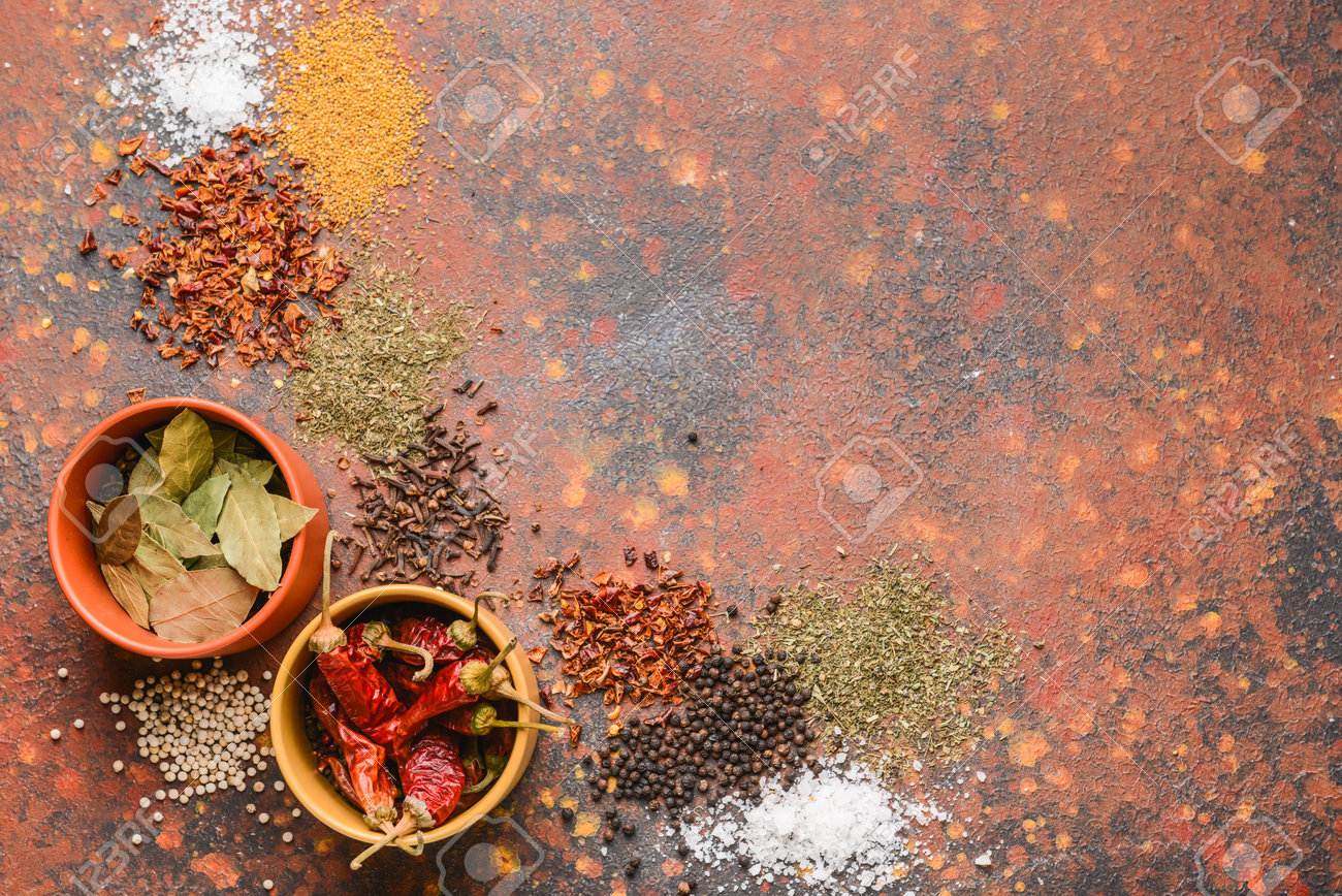 Bowls with different spices on color background - 165515629 Bowls with different spices on color background - 165515629