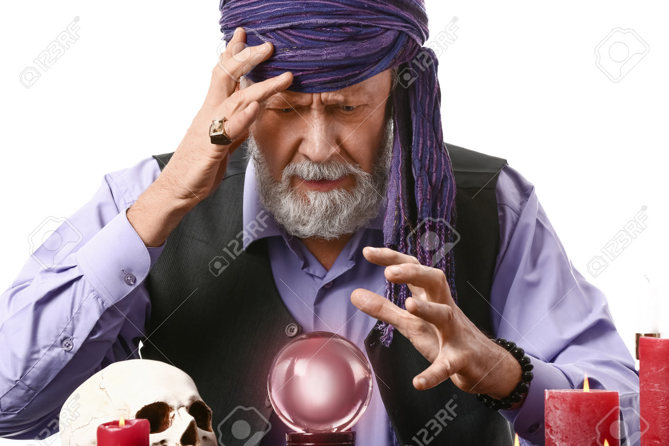Male Fortune Teller With Crystal Ball At Table On White Background Stock  Photo, Picture and Royalty Free Image. Image 197553477.