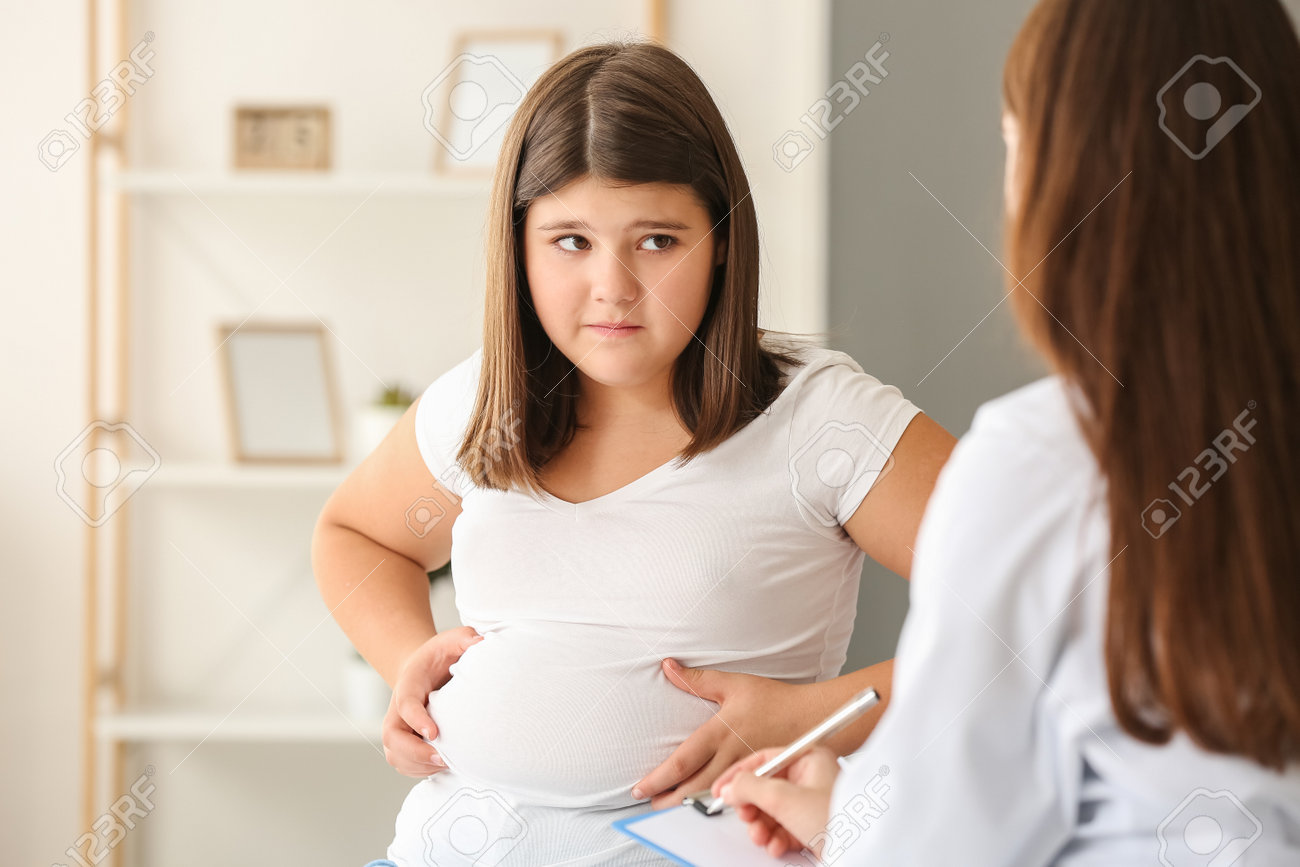 Sad Overweight Girl Visiting Nutritionist In Clinic Stock Photo, Picture  and Royalty Free Image. Image 198246983.