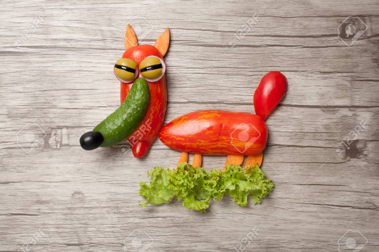 85109630-cunning-fox-made-of-fresh-vegetables-on-wooden-board.jpg