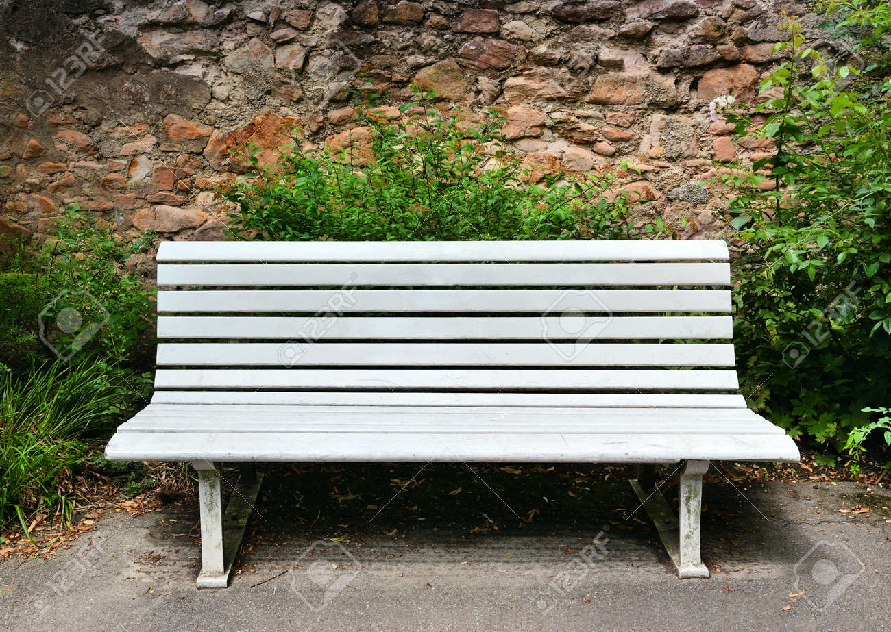 Wooden Bench Near A Stone Wall Stock Photo Picture And Royalty - Stock Photo Wooden Bench Near A Stone Wall wooden bench near a stone wall stock photo picture and royalty - stock photo wooden bench near a stone wall