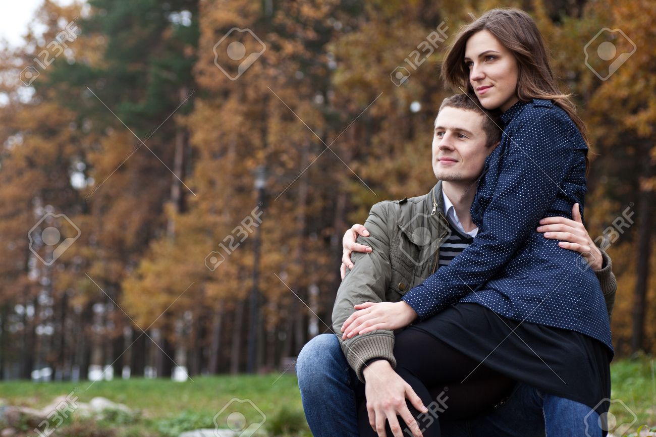 Girl Sitting On Lap Men And They Look Into Distance Stock Photo Picture And Royalty Free Image Image 16115880