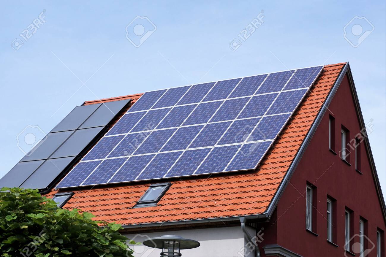 Ecological and renewable solar energy panels on the roof of a house - 132070658 Ecological and renewable solar energy panels on the roof of a house - 132070658