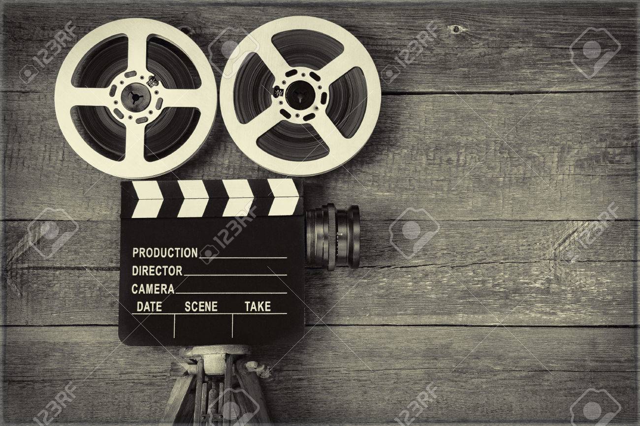 Old Movie Camera, Consisting Of A Tripod, Lens, Film Reels And  Clapperboards.Toned Photo. Stock Photo, Picture and Royalty Free Image.  Image 79405530., image size:1300x866