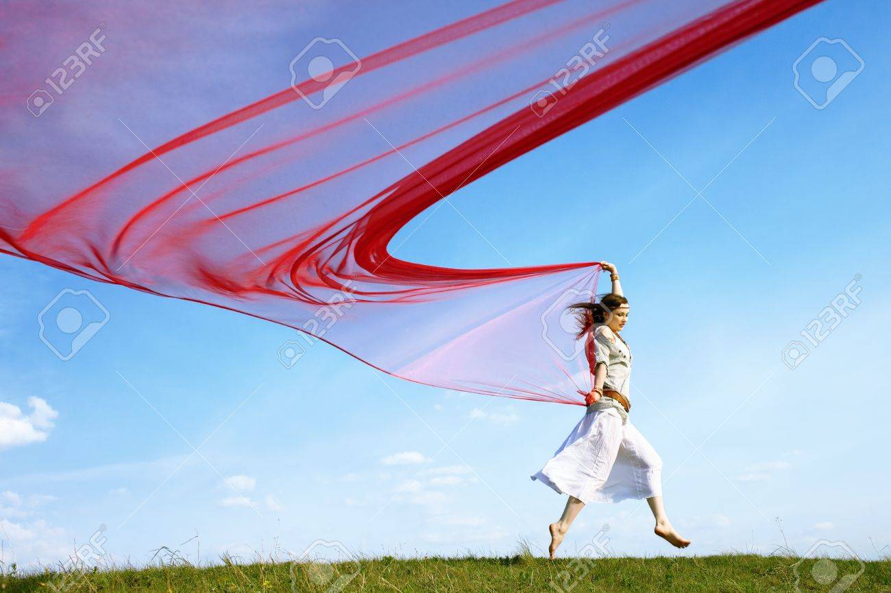Outdoor Portrait Of Beautiful Hippie Girl Running With Big Piece Of Red Light Cloth Under The Blue Sky Stock Photo Picture And Royalty Free Image Image