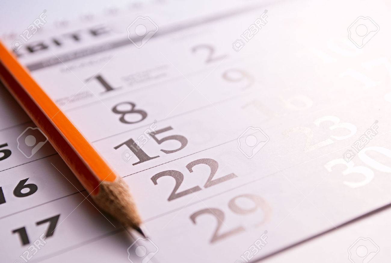 Close-up of a sharp pencil on the page of a calendar, in order to mark days with events - 30977274 Close-up of a sharp pencil on the page of a calendar, in order to mark days with events - 30977274