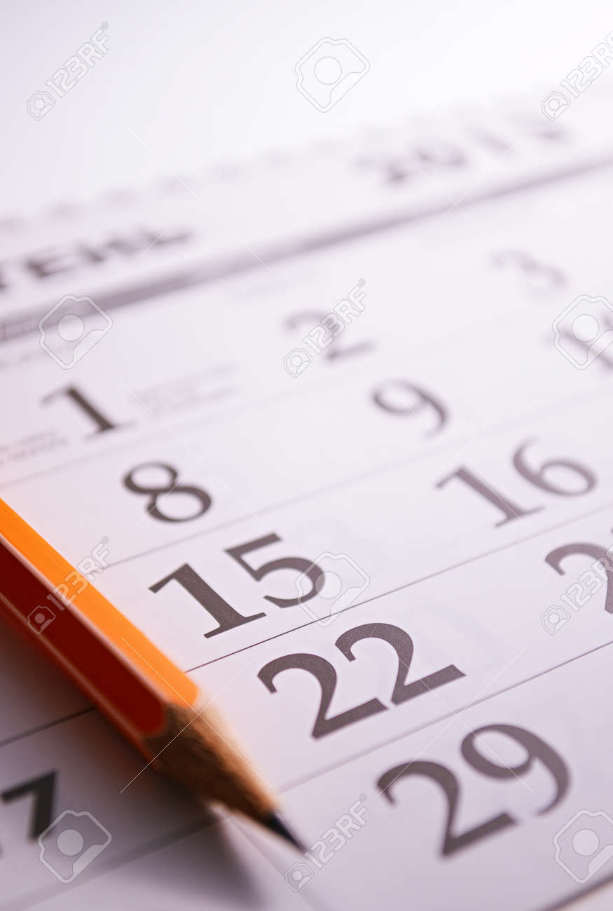 Close-up of a sharp pencil on the page of a calendar, in order to mark days with events - 30977206 Close-up of a sharp pencil on the page of a calendar, in order to mark days with events - 30977206