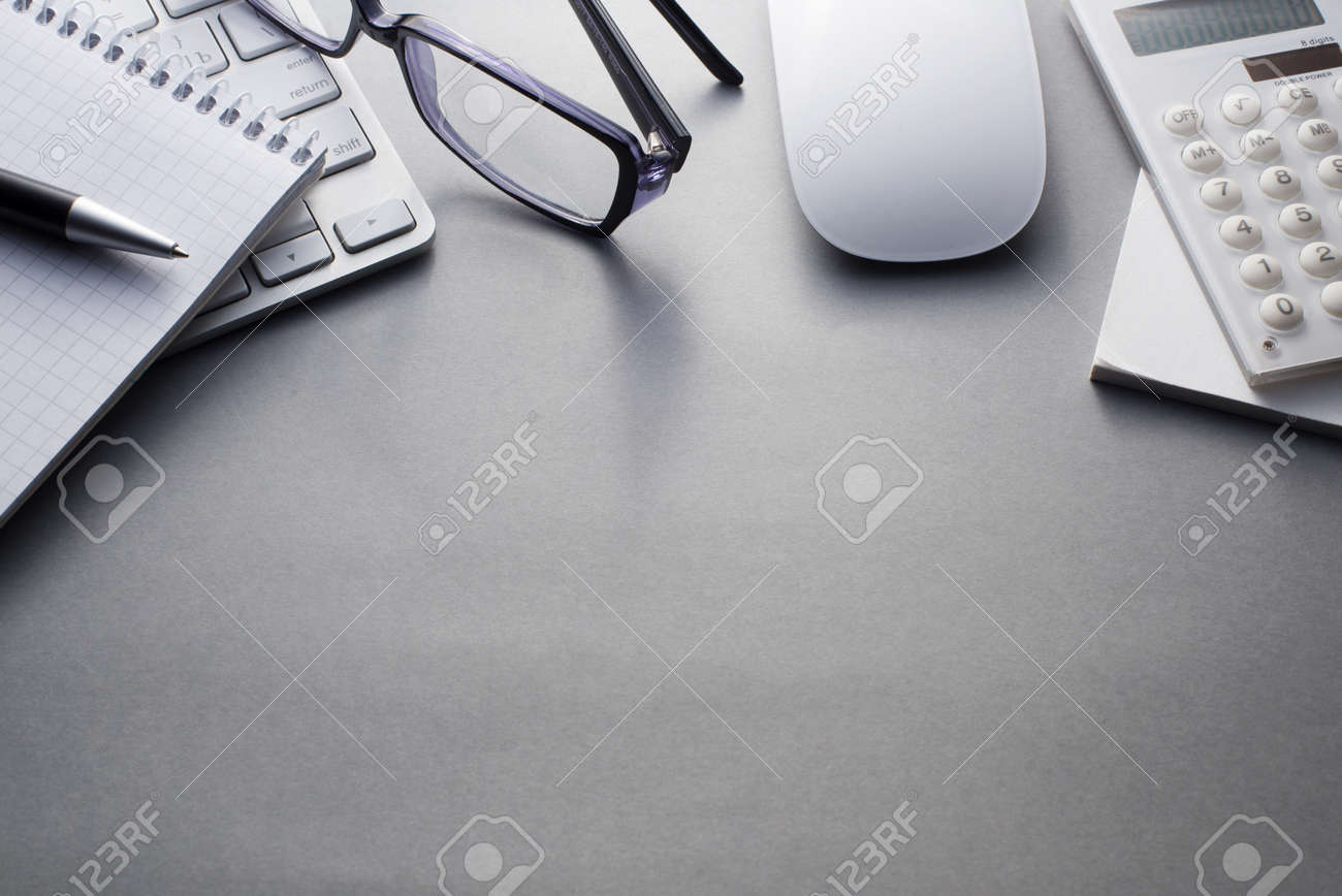 Angled View of Mac Computer Keyboard and Mouse with Various Office Supplies on Grey Desk with Ample Copy Space - 40628492 Angled View of Mac Computer Keyboard and Mouse with Various Office Supplies on Grey Desk with Ample Copy Space - 40628492