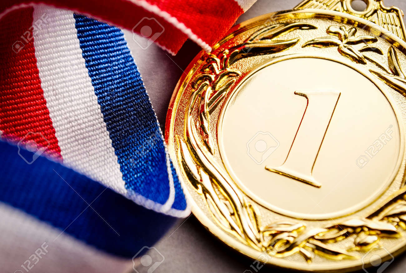 Gold medal in the foreground on three-colour ribbon - 41722523 Gold medal in the foreground on three-colour ribbon - 41722523