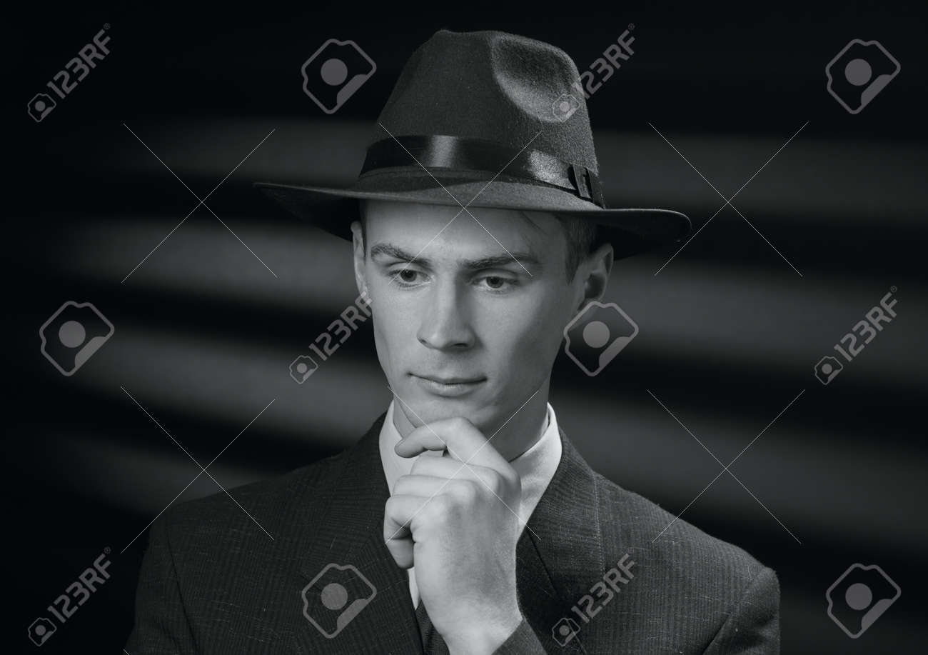 The detective thinks vintage black and white portrait of a thoughtful