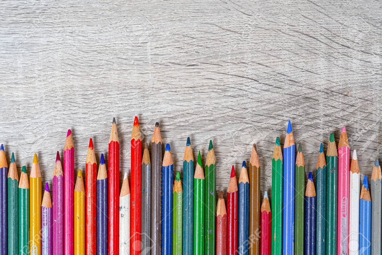 Some Old Colored Pencils Lined Up On A Wooden Table Stock Photo Picture And Royalty Free Image Image