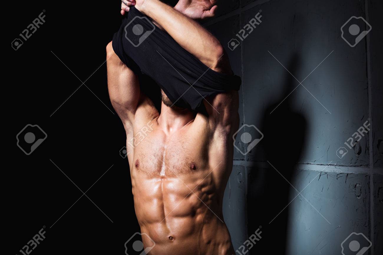 Muscular And Sexy Body Of Young Man Stripping Stock Photo, Picture and  Royalty Free Image. Image 38315065.