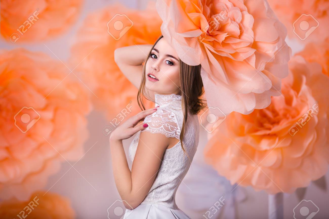 Young beautiful girl posing in paper flowers in spring studio - 38432457 Young beautiful girl posing in paper flowers in spring studio - 38432457
