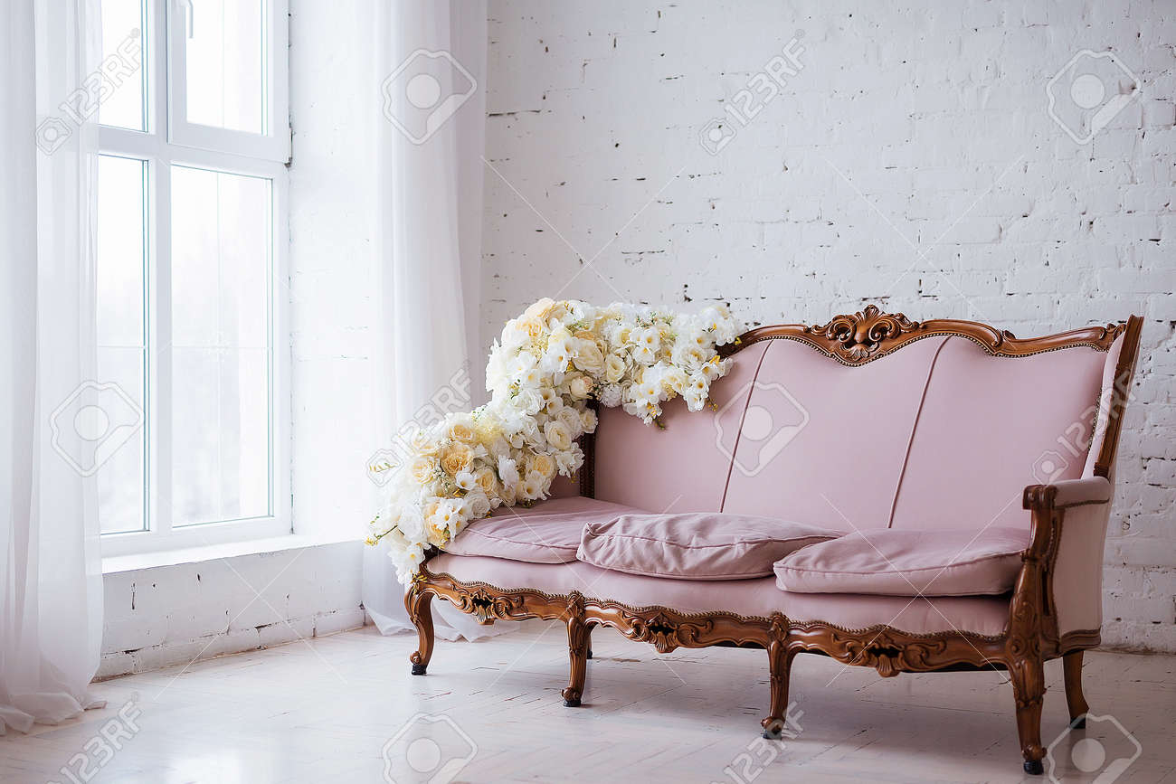 vintage style sofa retro stock photo vintage style sofa decorated with flowers in loft interior room big window style sofa decorated with flowers in loft interior room vintage style sofa retro stock photo vintage style sofa decorated with flowers in loft interior room big window style sofa decorated with flowers in loft interior room