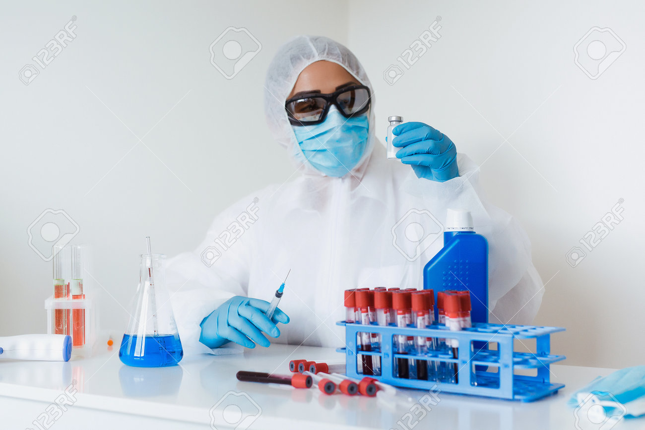 Doctor hands in gloves holding syringe and vaccine. Prevention, immunization and treatment from corona virus, flue, infection. concept of vaccination, injection, medicine. - 160752616 Doctor hands in gloves holding syringe and vaccine. Prevention, immunization and treatment from corona virus, flue, infection. concept of vaccination, injection, medicine. - 160752616