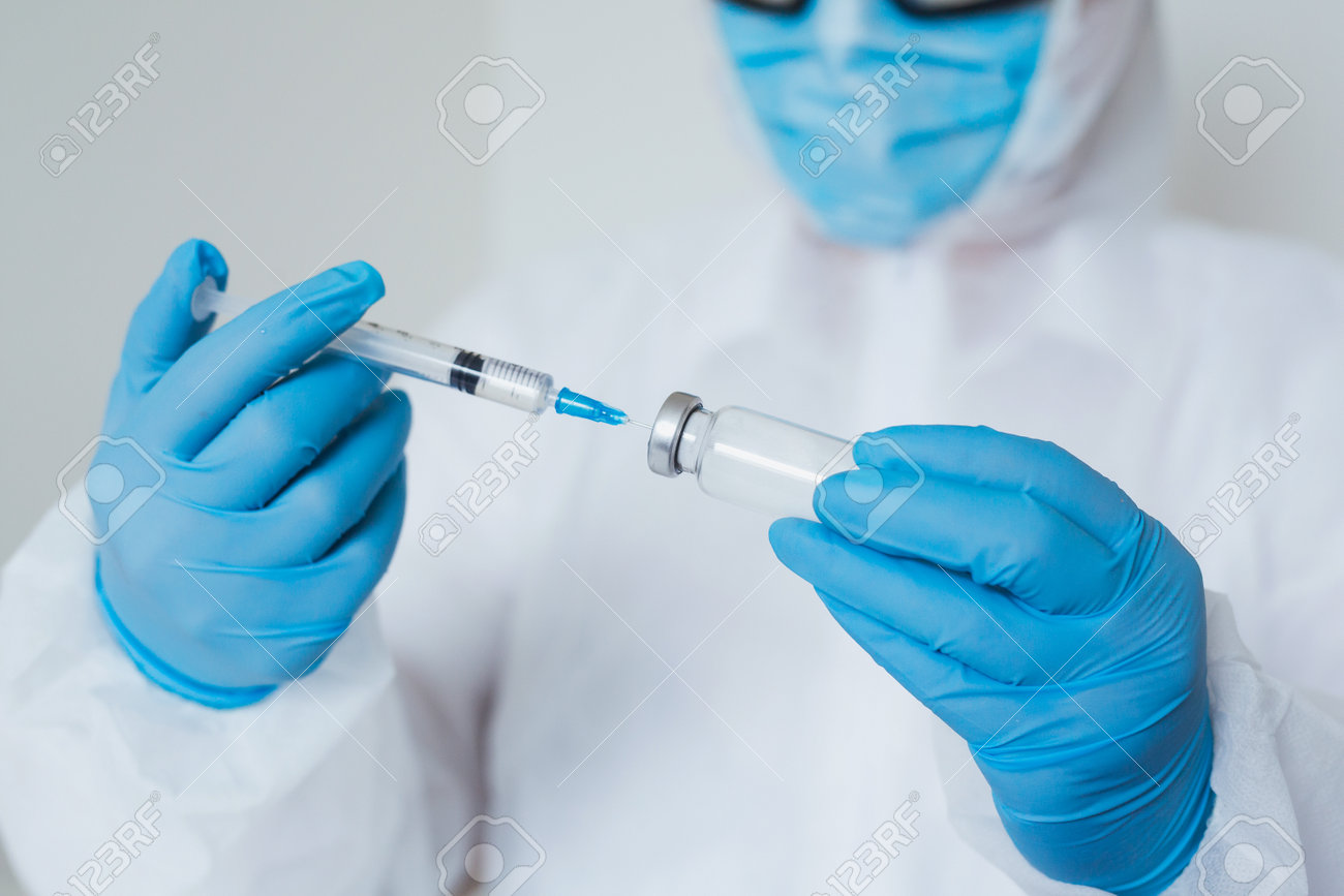 Close-up doctor hands in gloves holding syringe and vaccine. Prevention, immunization and treatment from corona virus, flue, infection. concept of vaccination, injection, medicine. - 160752433 Close-up doctor hands in gloves holding syringe and vaccine. Prevention, immunization and treatment from corona virus, flue, infection. concept of vaccination, injection, medicine. - 160752433