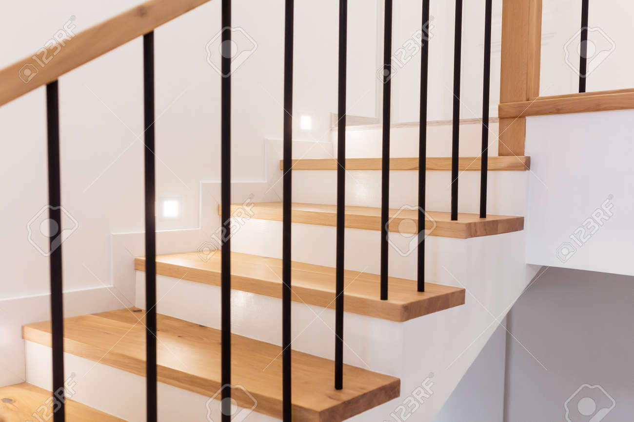 Wood staircase inside contemporary white modern house. - 165106452 Wood staircase inside contemporary white modern house. - 165106452