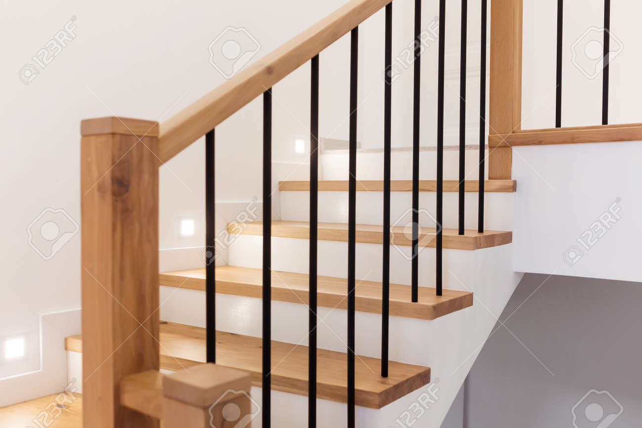 Wood staircase inside contemporary white modern house. - 165106450 Wood staircase inside contemporary white modern house. - 165106450