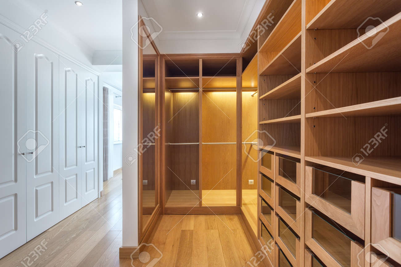 Cabinets And An Empty Dressing Room Made Of Wood For Family