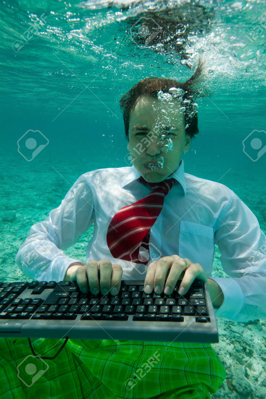 11753894-young-businessman-with-keyboard-in-formal-clothes-working-underwater.jpg