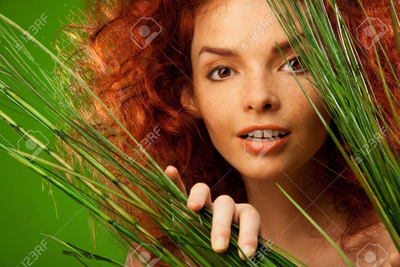 [Image: 11753999-beauty-portrait-of-woman-lookin...h-bush.jpg]