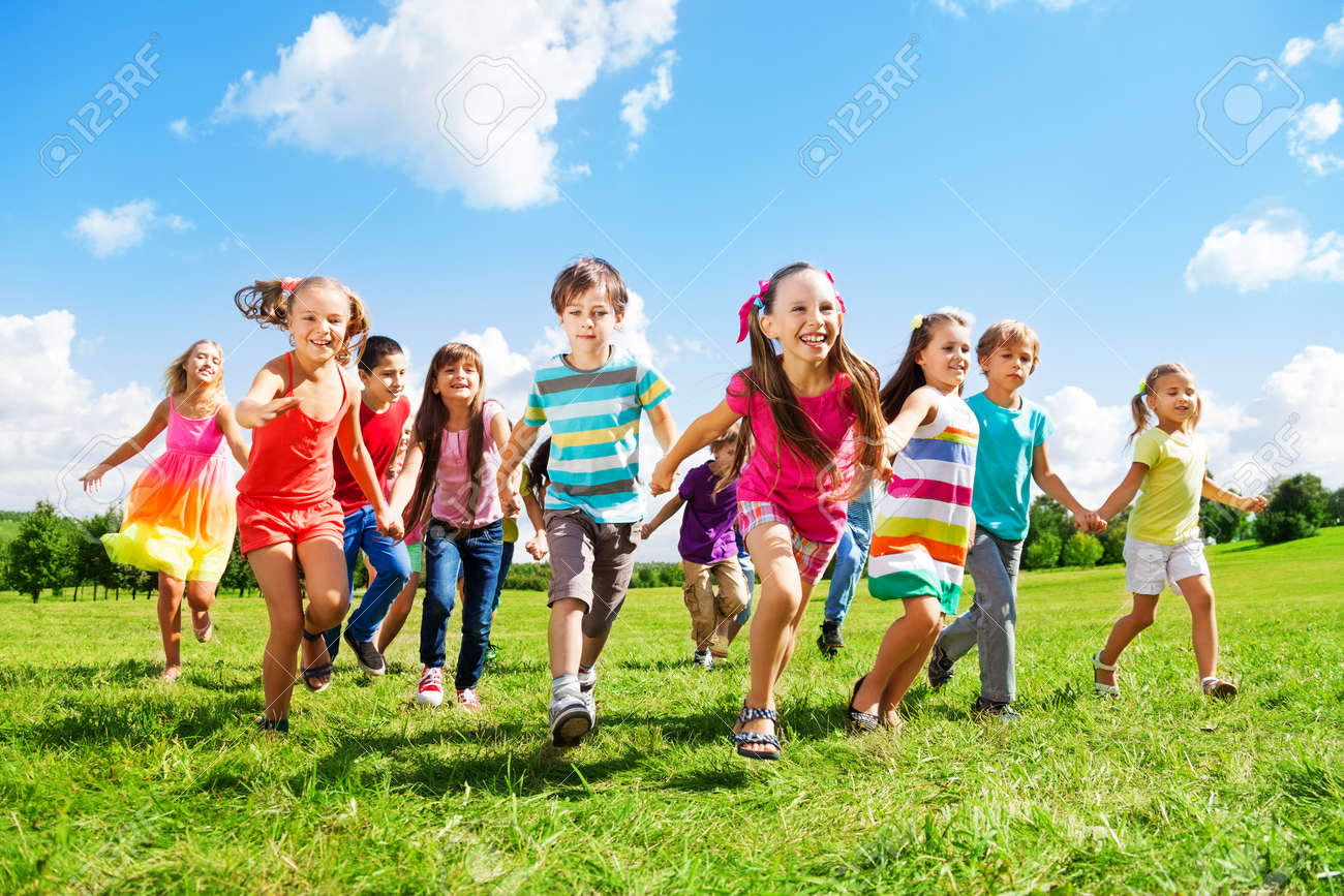 Many different kids, boys and girls running in the park on sunny summer day in casual clothes - 22404189 Many different kids, boys and girls running in the park on sunny summer day in casual clothes - 22404189