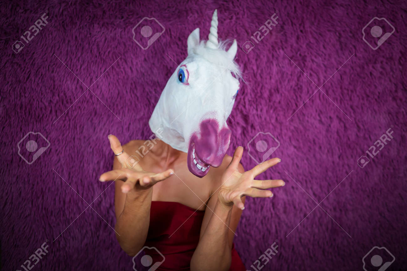 funny girl unicorn is very surprised and gesticulating freaky