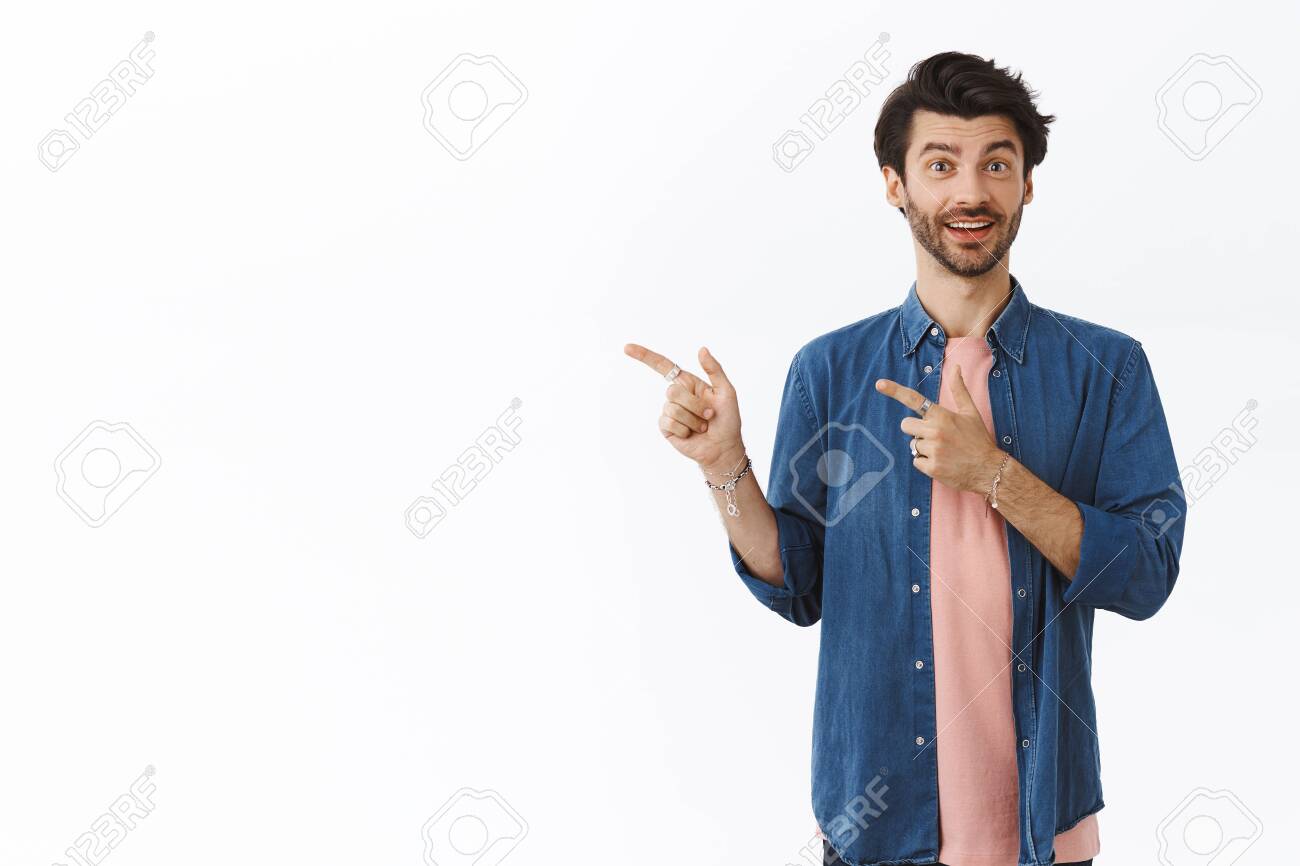 Handsome Cheerful, Friendly-looking Smiling Guy Inviting You For Drink,  Asking Out. Man Grinning And Pointing Left, Looking Camera Amused, Tell  Friends Go Visit Nice Place, Advertising Stock Photo, Picture and Royalty  Free, image size:1300x866