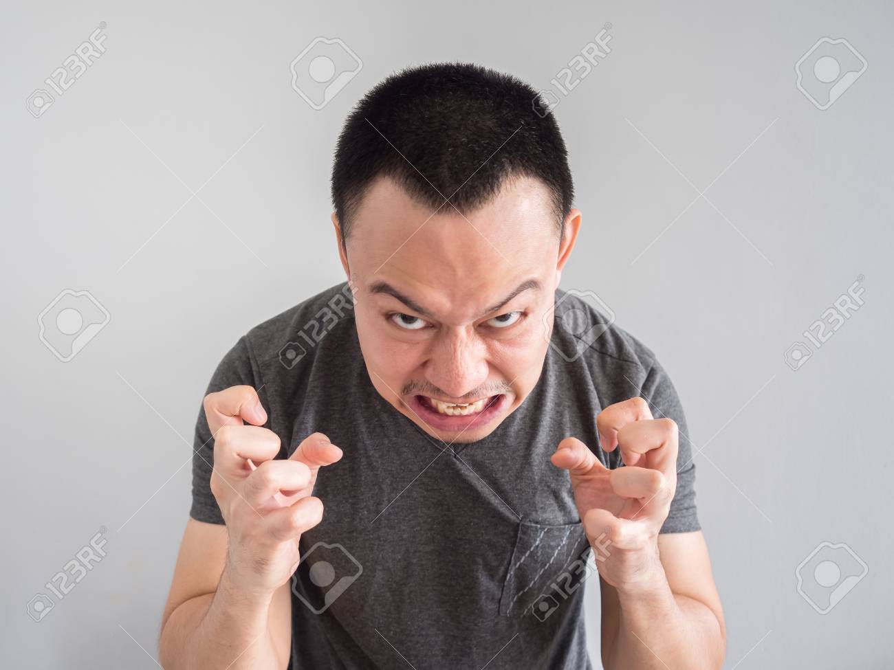 Angry Asian Man Portrait With Funny Mad Face Stock Photo Picture And Royalty Free Image Image 83226924