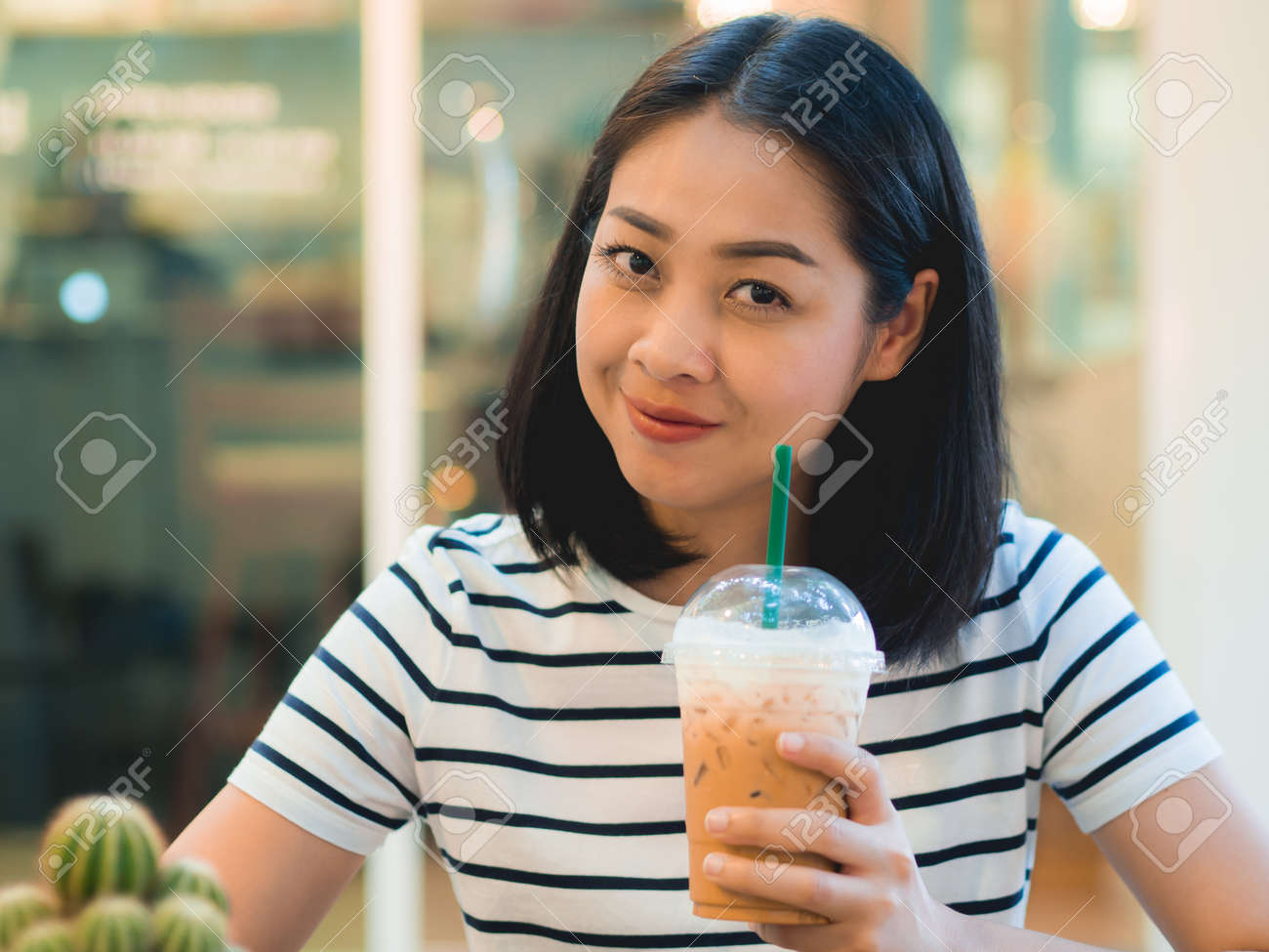 Asian Woman Drink Iced Coffee In The Cafe Stock Photo Asian Woman Drink Iced Coffee In The Cafe Stock Photo