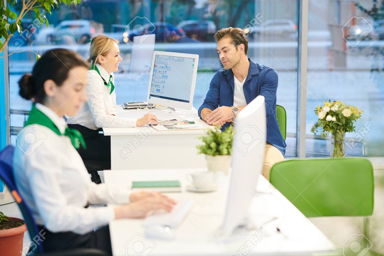 Bank sales consultant working with customer - 113804821 Bank sales consultant working with customer - 113804821
