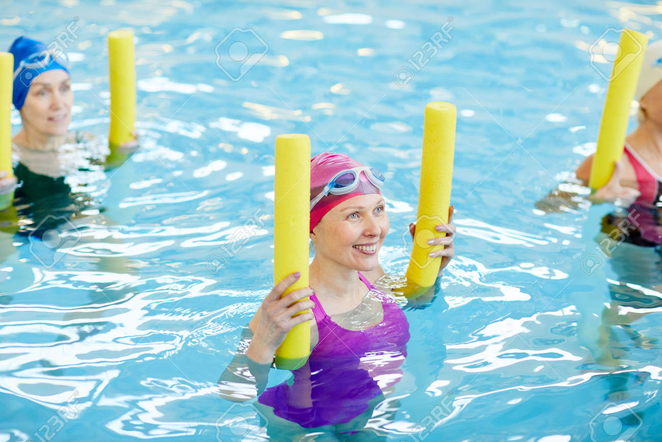 Adult Women Working Out in Water - 117101084 Adult Women Working Out in Water - 117101084