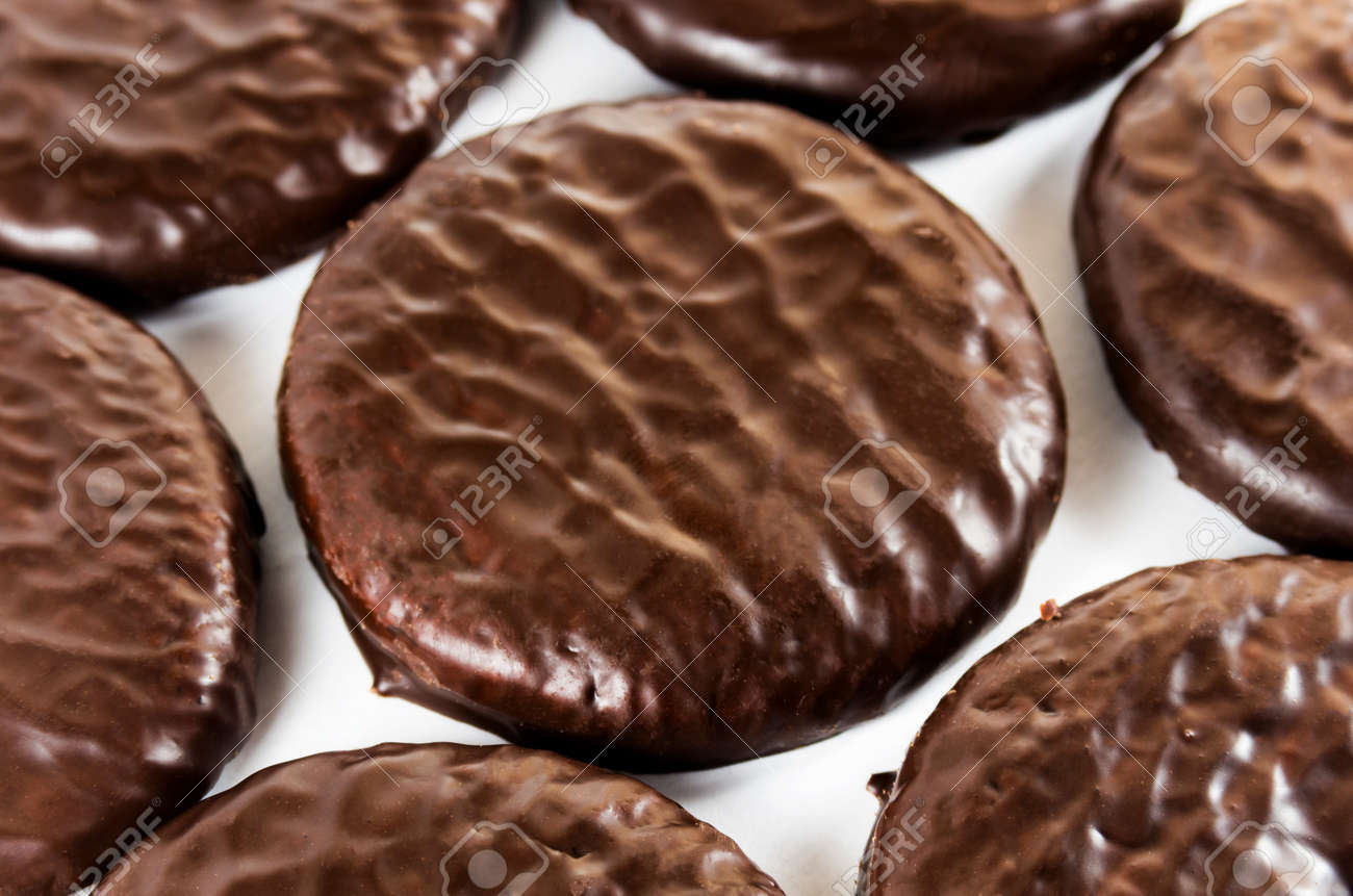 Chocolate glazed cookies on a white background - 136890342 Chocolate glazed cookies on a white background - 136890342