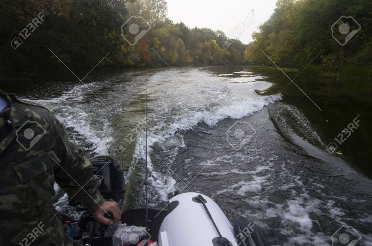 Ride on an inflatable boat on the autumn river - 158532318 Ride on an inflatable boat on the autumn river - 158532318