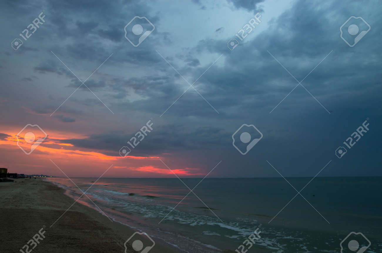 Sunset over the sea in cloudy weather, landscape - 158581469 Sunset over the sea in cloudy weather, landscape - 158581469