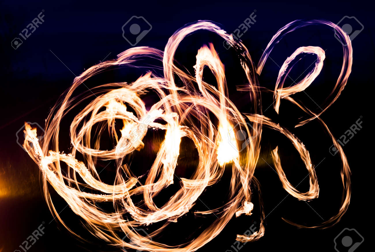 Colorful fire show of lights in the dark, background - 158581539 Colorful fire show of lights in the dark, background - 158581539