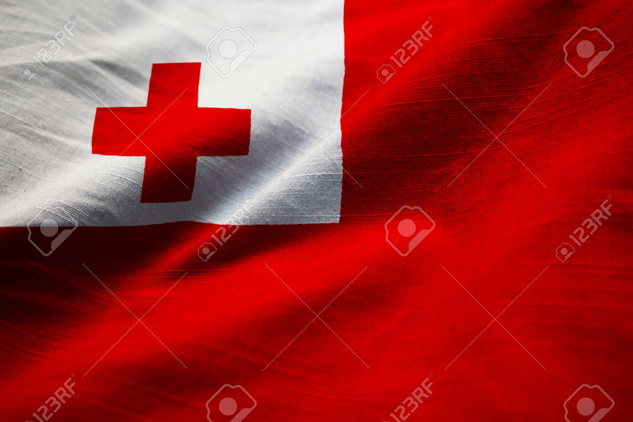 closeup of ruffled tonga flag tonga flag blowing in wind stock