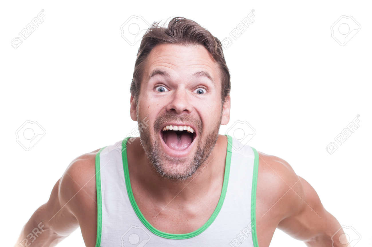 Bearded Muscular Caucasian Man In Tank Top Leans Forward At Camera And Yells With Extreme Excitement On White Background Stock Photo Picture And Royalty Free Image Image