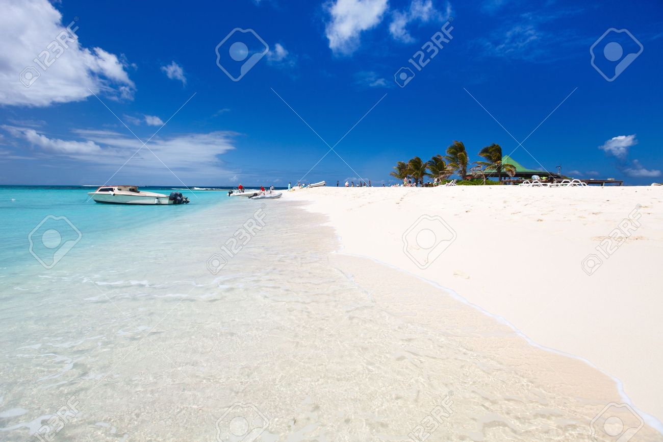 Crystal Clear Water And White Sand Beach Boat On The Water Stock