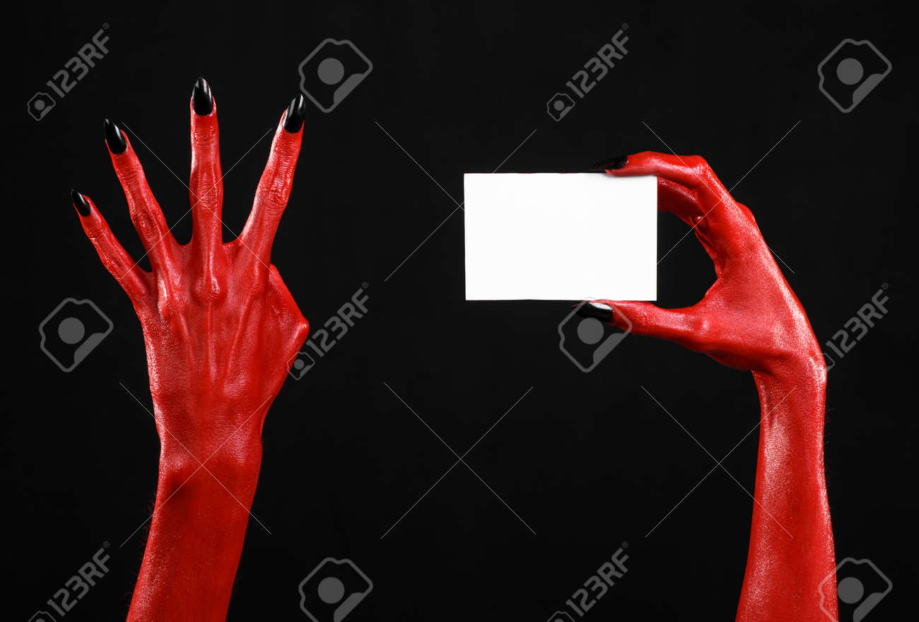 Halloween Theme Red Devil Hand With Black Nails Holding A Blank Stock Photo Picture And Royalty Free Image Image 56173189