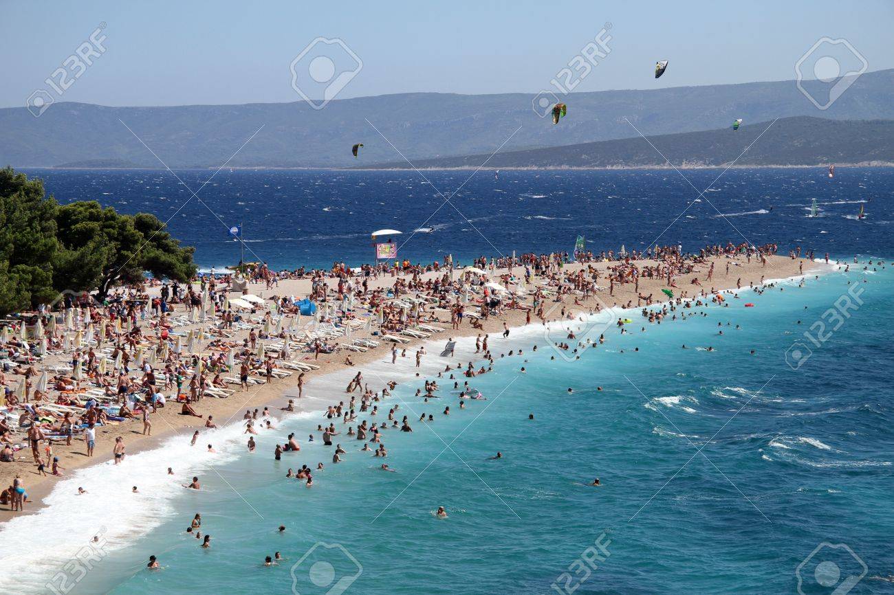 People On The Beach Zlatni Rat In Bol Brach Island Croatia
