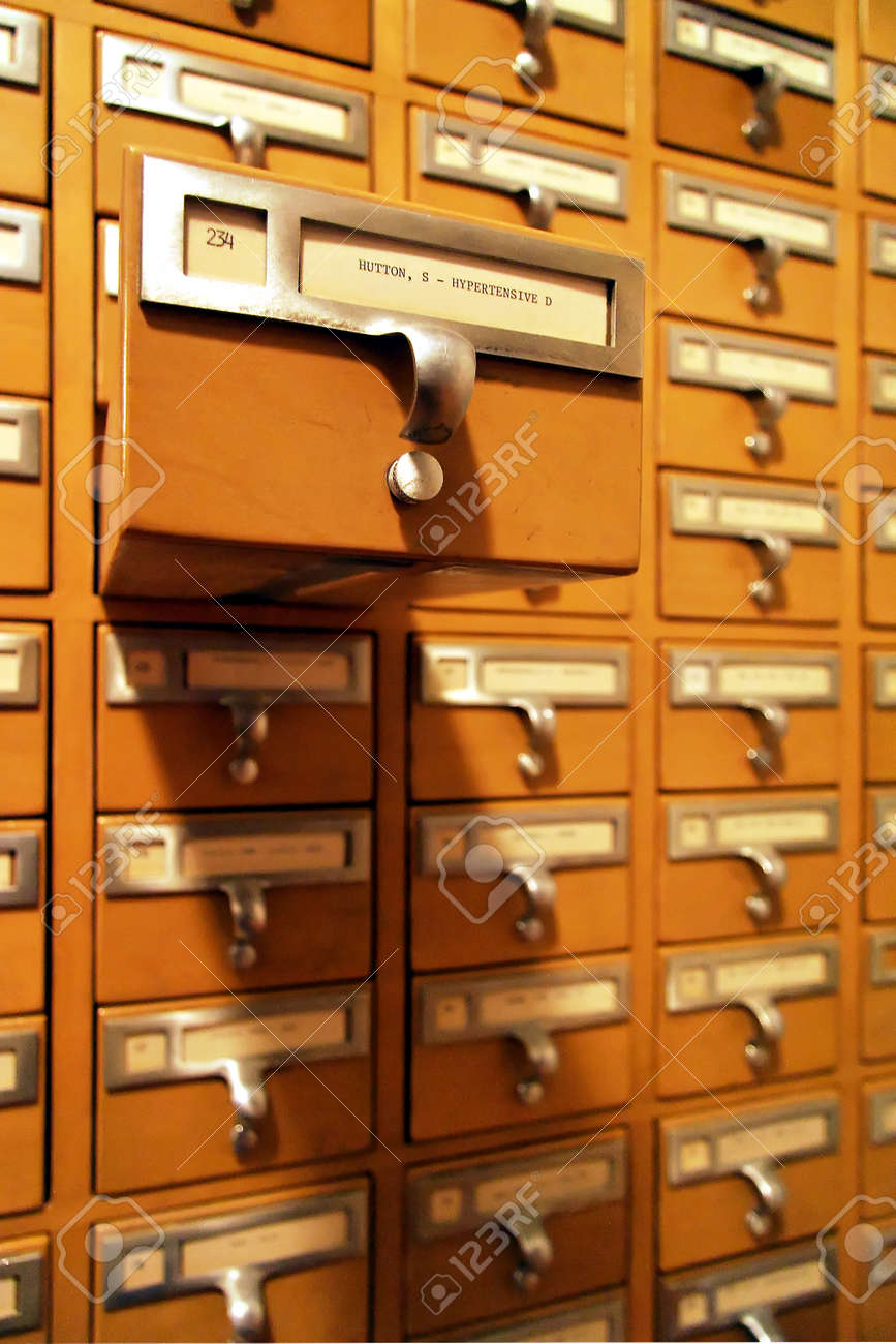 A Large Library Card Catalogue With One Drawer Open From The