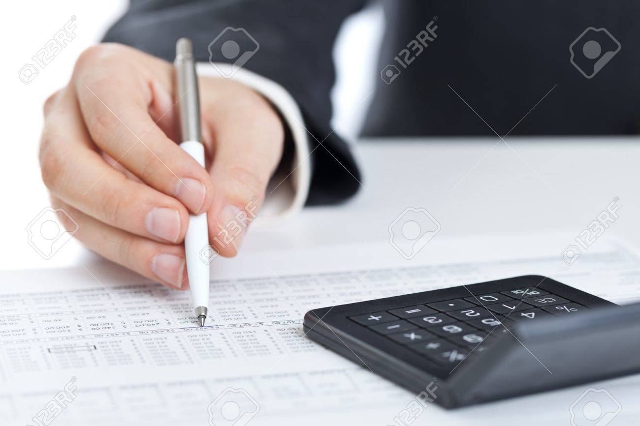 business finance man calculating budget numbers with calculator calculator budget