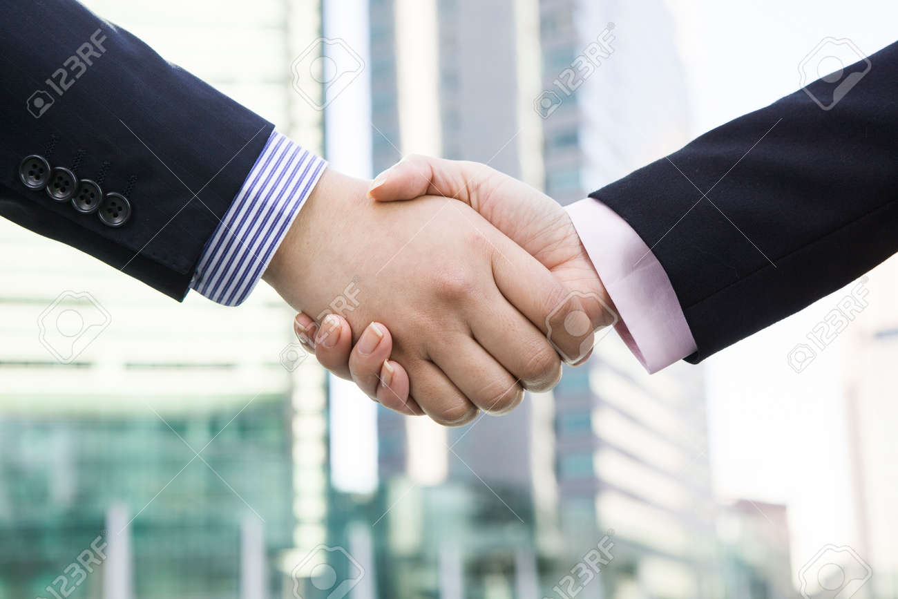 Office workers shaking hands - 52400346 Office workers shaking hands - 52400346