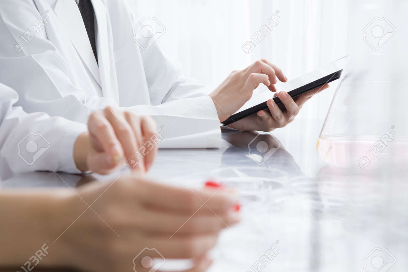 Researchers are using electronic tablet in the laboratory - 50948804 Researchers are using electronic tablet in the laboratory - 50948804