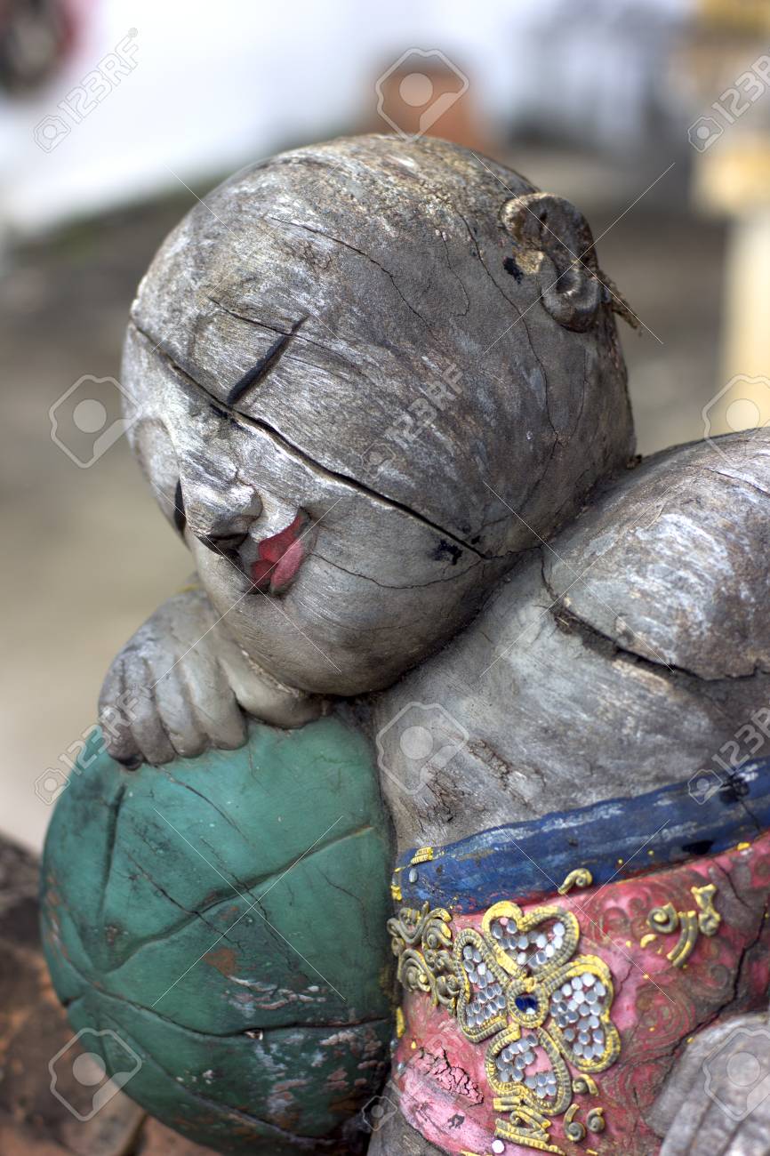 old wooden doll