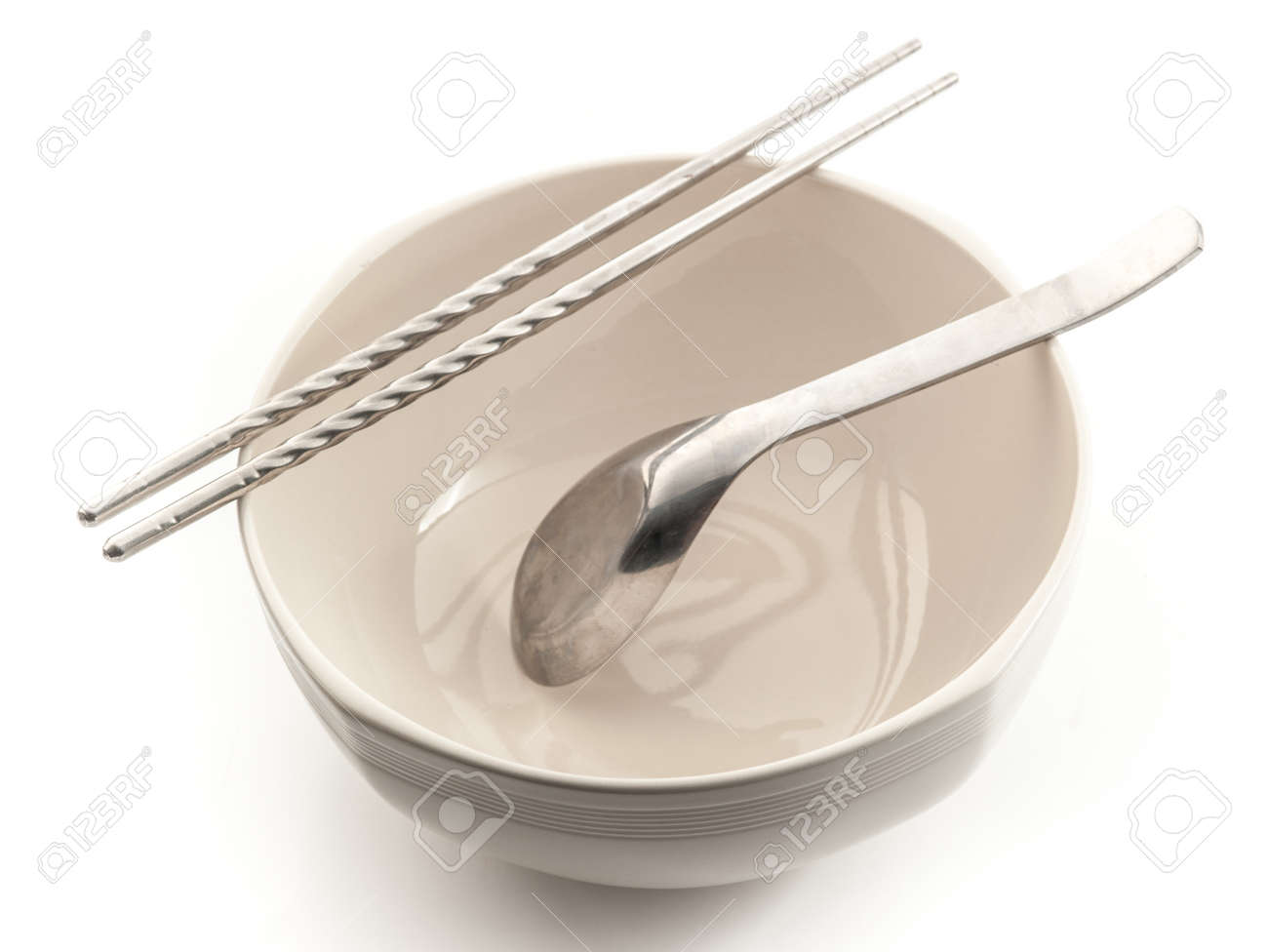 Bol Avec Des Baguettes Et Cuillere Isole Sur Fond Blanc