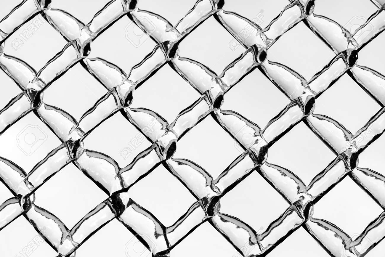 A Close Up Shot Of Thick Layer Of Ice Covering A Frozen Metal Chain Link  Fence After An Ice Storm. Processed In Black And White. Stock Photo,  Picture and Royalty Free Image.