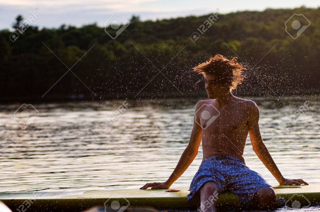 Teen Boy Shaking His Wet Hair At The