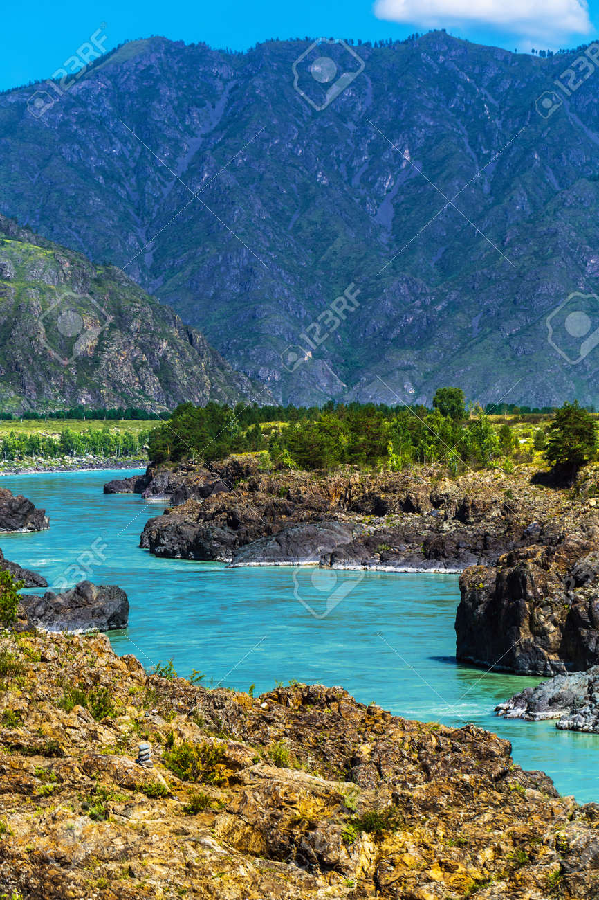 Chemal district, Altai Republic, southern Siberia, Russia - August 15, 2019: a view of the Katun river and rapids Teldekpen have Oroktoysky bridge - 129773590 Chemal district, Altai Republic, southern Siberia, Russia - August 15, 2019: a view of the Katun river and rapids Teldekpen have Oroktoysky bridge - 129773590